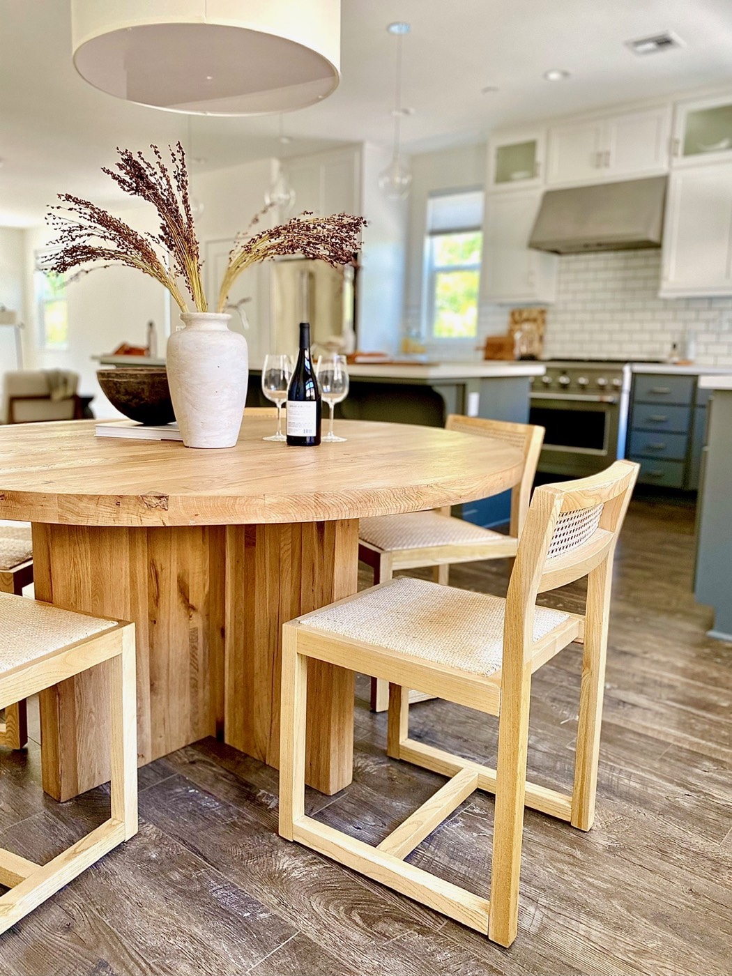 Dining area arranged beside an open kitchen to show how the spaces connect