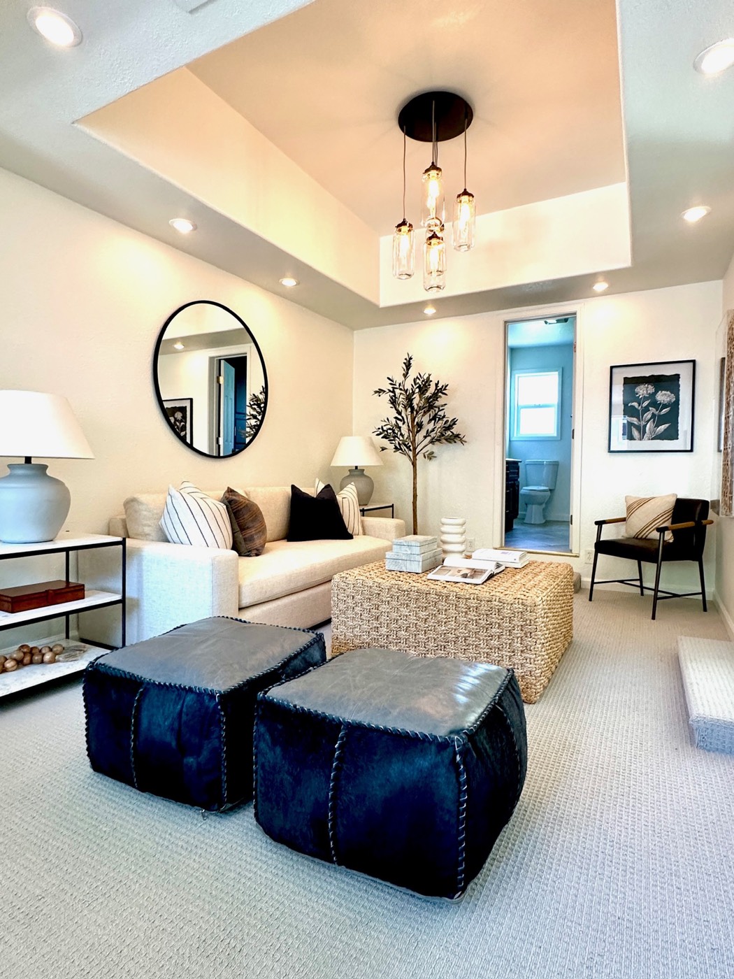 Bright prepared living room with seating, rug and coordinated furnishings